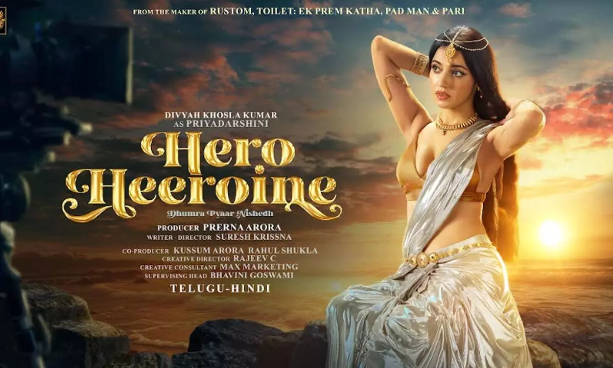 After the massive response from the first look of ‘Hero Heroine’, makers drop another glimpse & commence the shoot in Hyderabad