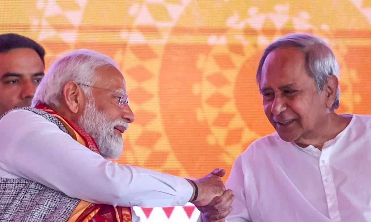 Prime Minister Narendra Modi with Odisha Chief Minister Naveen Patnaik during the inauguration of various developmental projects, in Sambalpur on Saturday