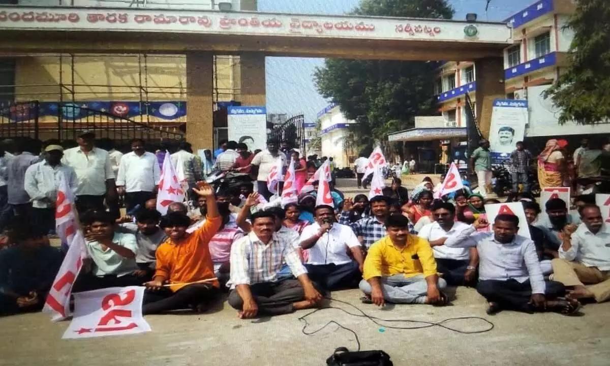 Relatives of the deceased student David Raju and tribals staging a dharna at NTR regional hospital in Anakapalli district on Monday