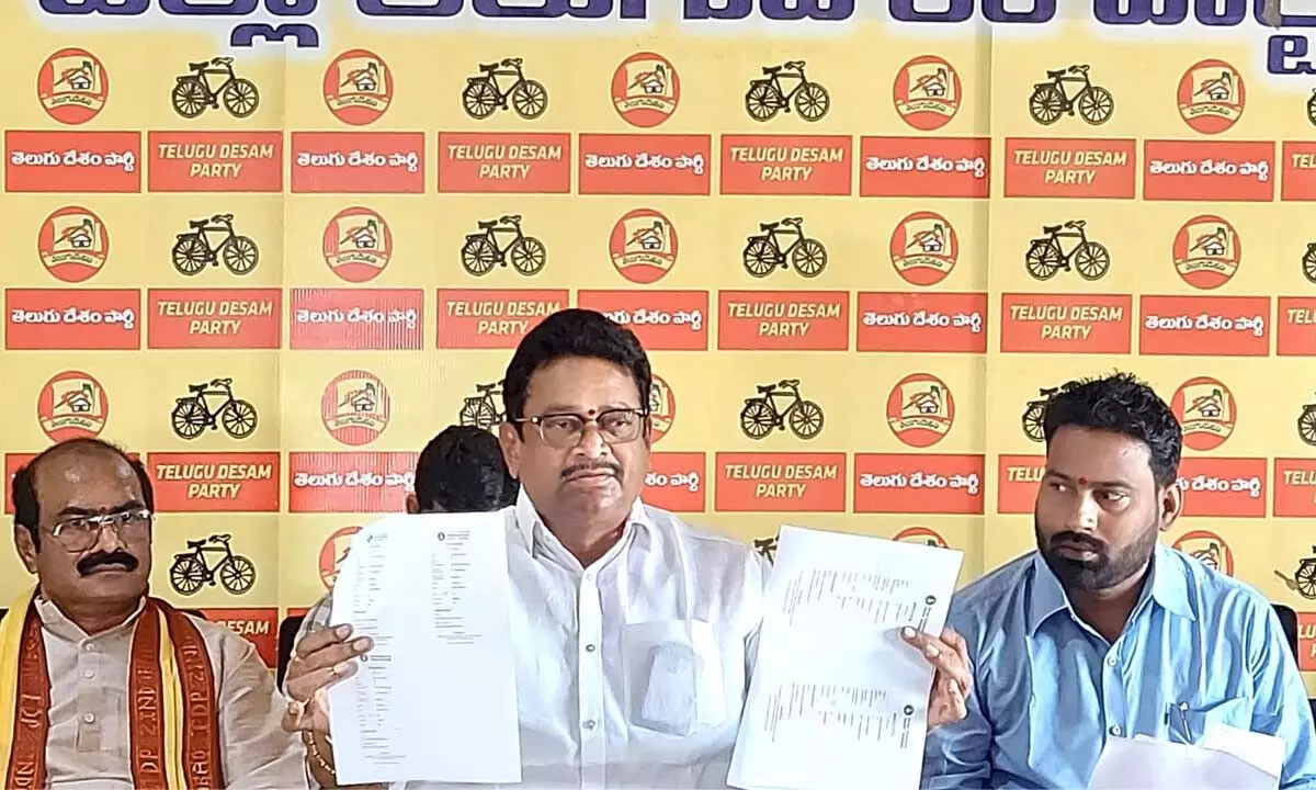 TDP leader  K Venkata Ramana (centre) showing voters’ lists alleged containing names of Odisha residents as local voters at a press conference in Srikakulam on Tuesday