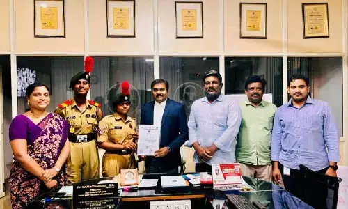 Principal Dr Ramachandra RK and NCC officers appreciating NCC female cadets who participated in the Republic Day parades held in New Delhi and Vijayawada