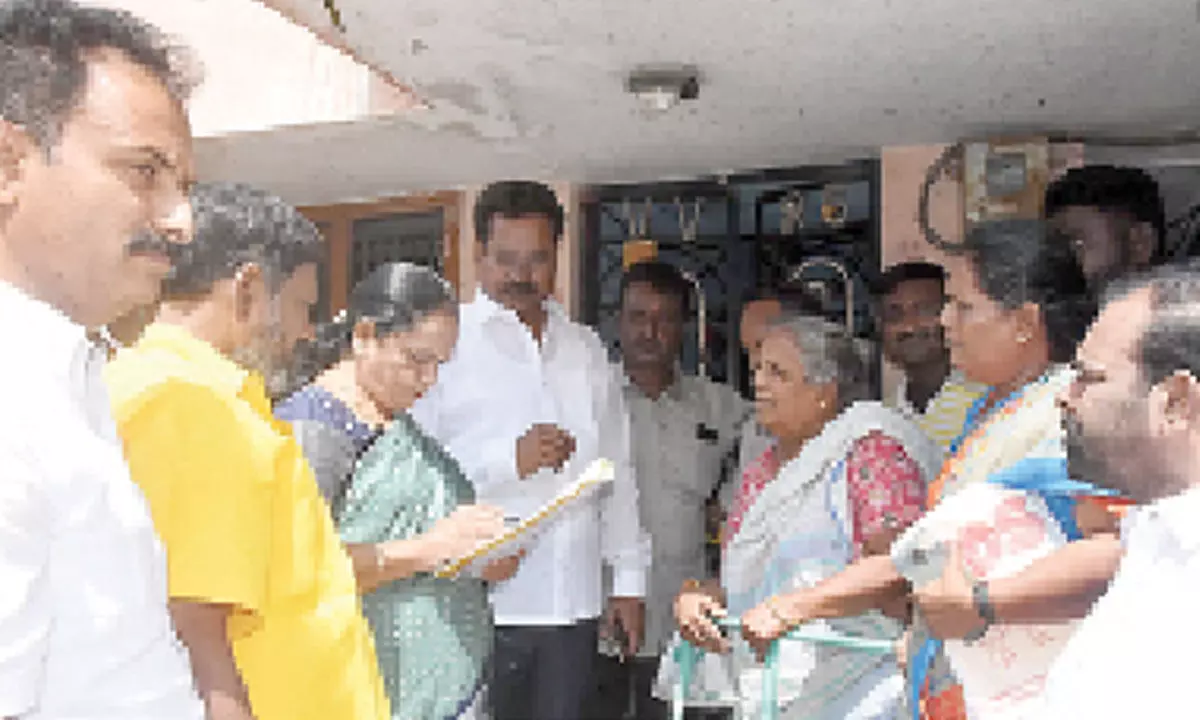 TDP leaders M Sugunamma, G Narasimha Yadav and others verifying voters’ lists at Bhagat Singh colony in Tirupati on Monday