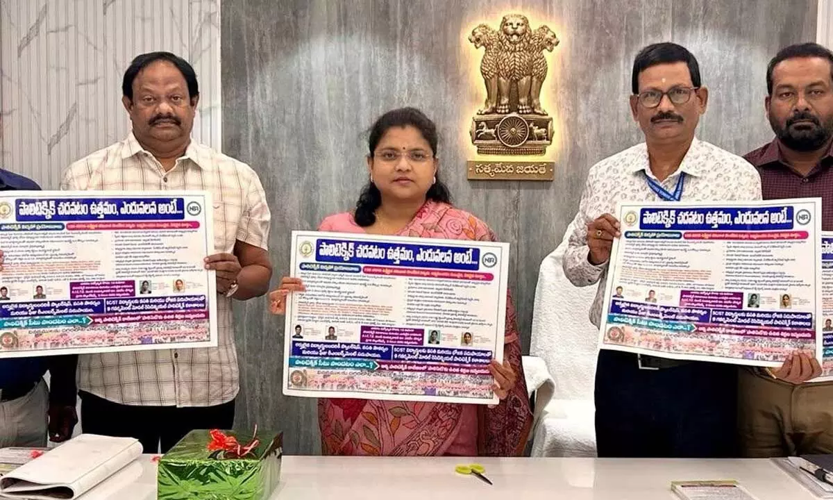 State Technical Education Commissioner Chadalavada Nagarani along with State Technical  Education Training Board secretary Ramana Babu,  Controller of Examinations Janaki Ramaiah and others releasing the wall poster promoting polytechnic courses in Vijayawada on Monday