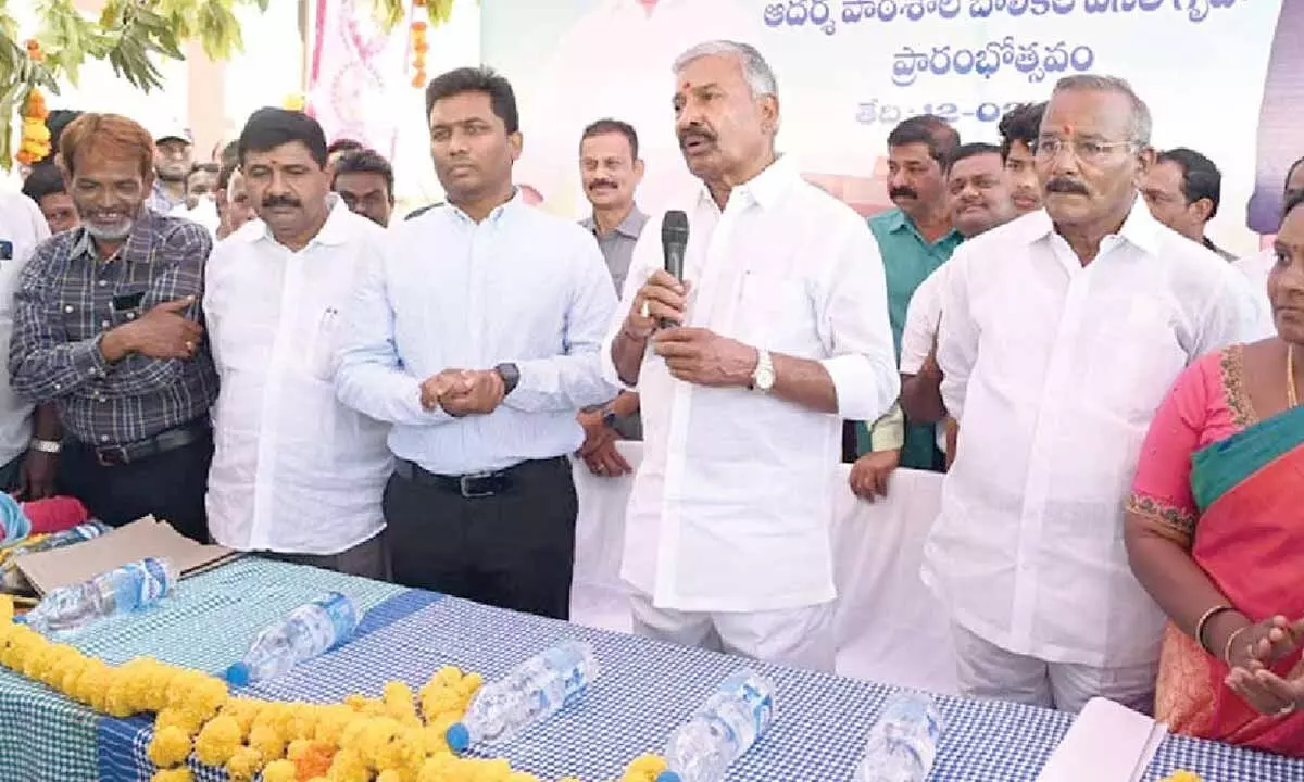 Minister Peddireddi Ramachandra Reddy speaking at the inauguration of model school girls hostel building in Pulicherla on Monday. Chittoor district Collector S Shan Mohan is also seen.
