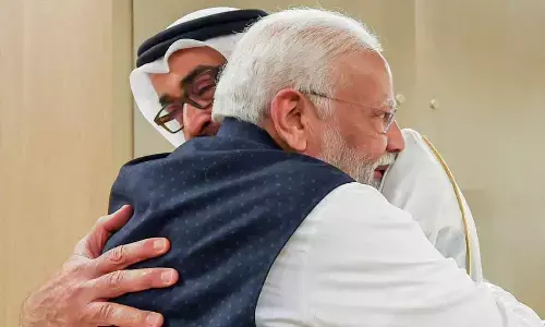 Prime Minister Narendra Modi being received by UAE President Mohamed bin Zayed Al Nahyan upon his arrival in Abu Dhabi on Tuesday