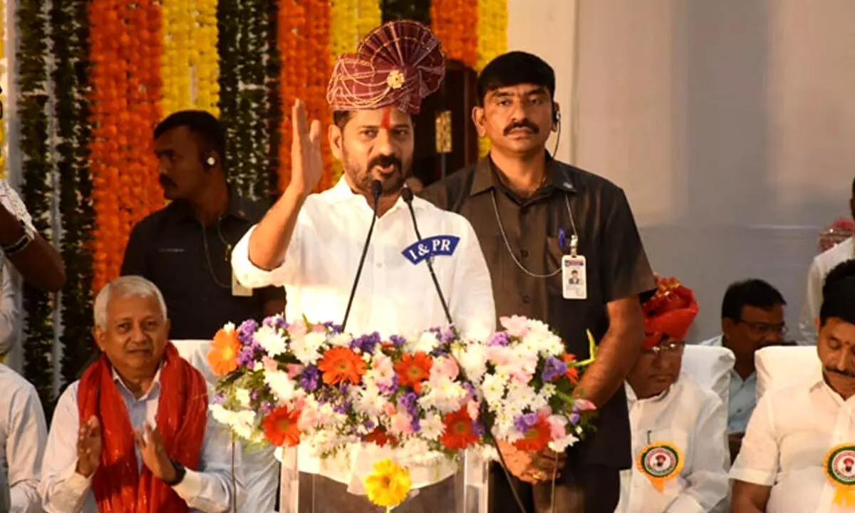 Revanth Reddy participates in Sant Sewalal Jayanti celebrations, assures to build schools in Tandas