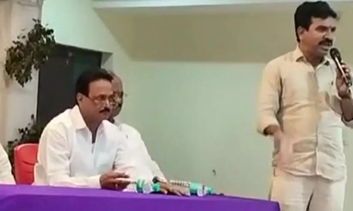 A leader from a rebel group speaking at the meeting conducted against YSRCP sitting MLA Dharmana Krishna Das at a hotel in Narasannapet on Monday