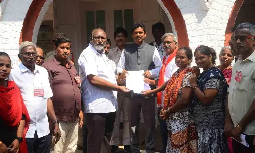 Street hawkers and CPM leaders submitting a memorandum to NTR District Collector S Dilli Rao in Vijayawada on Monday