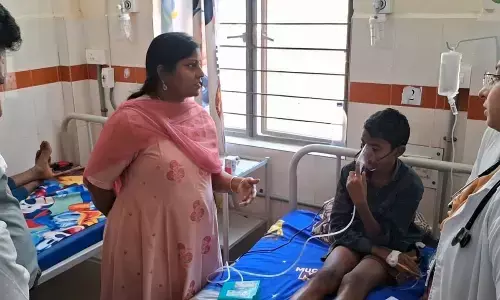 Joint collector Lavanya Veni enquiring about health of a student undergoing treatment at hospital in Jangareddigudem on Tuesday