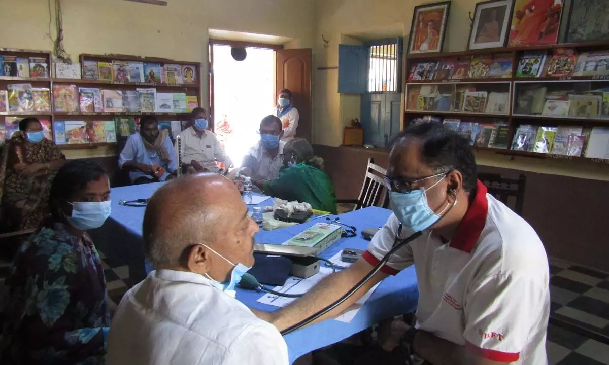 Dr Anil Kanala examining a hypertensive patient