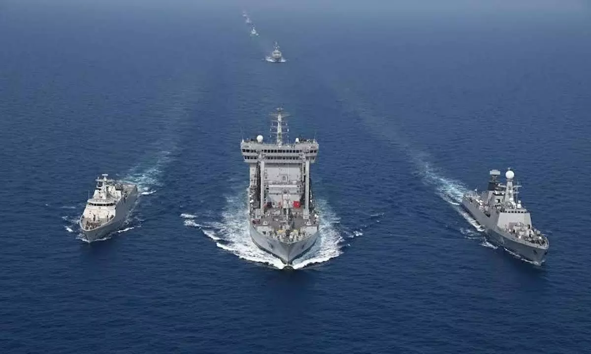 Ships carrying out feats as part of the sea phase of MILAN 2024 in Visakhapatnam