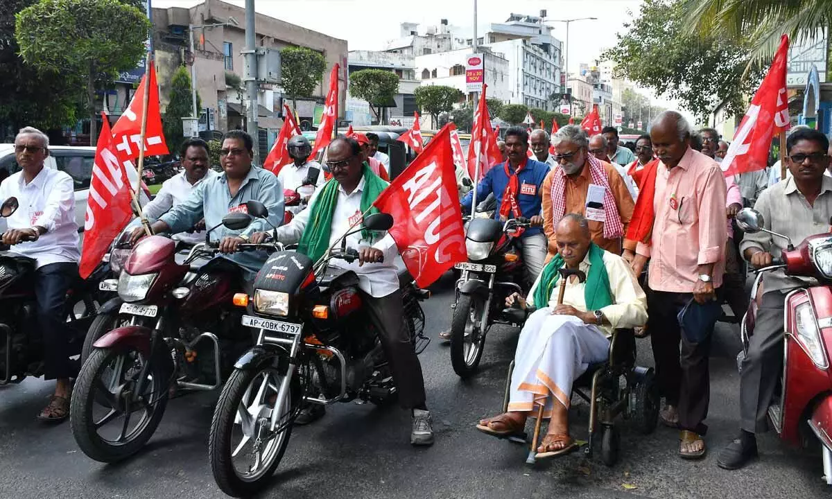 Members of farmers associations taking part in a bike rally in Vijayawada on Monday. Former MP Vadde Sobhanadreeswara Rao also took part in the rally.  Photo: Ch Venkata Mastan