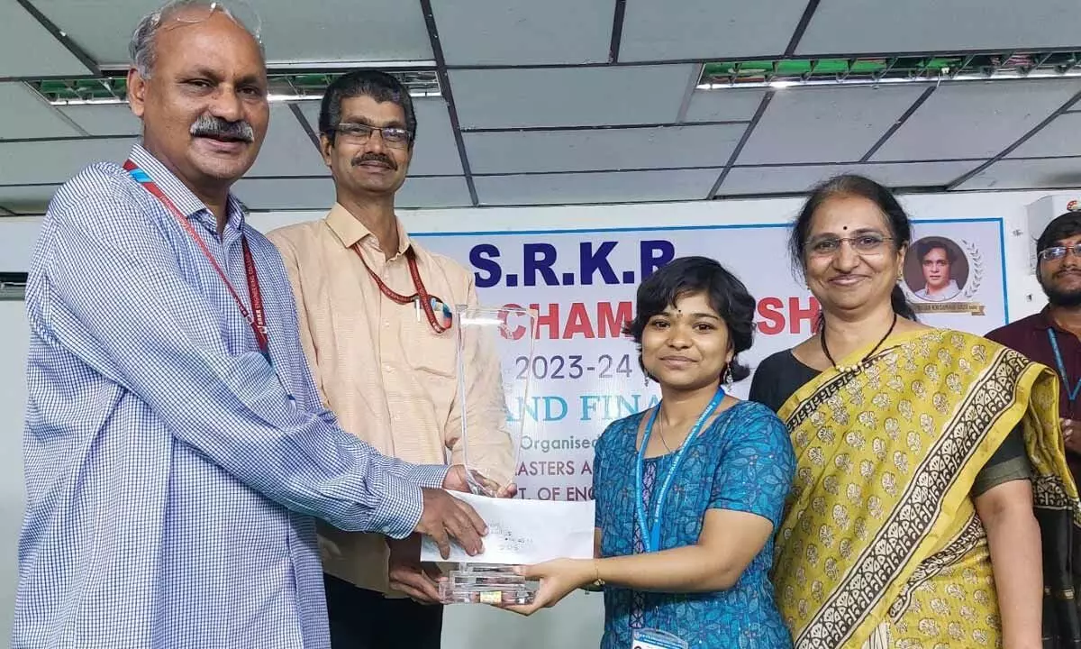 A Jahnavi being presented with cash award of Rs 5,000 at SRKR Engineering College in Bhimavaram on Monday