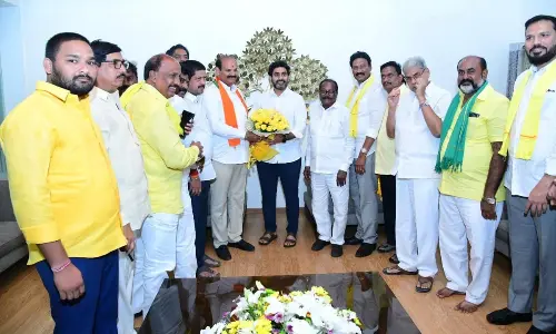 Penamaluru YSRCP MLA Kolusu Parthasarathy joins TDP in the presence of party national general secretary Nara Lokesh in Vijayawada on Monday