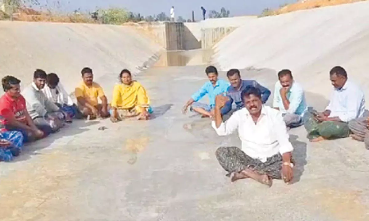 TDP workers staging a protest at the Kuppam branch canal near Santhipuram mandal  on Monday evening