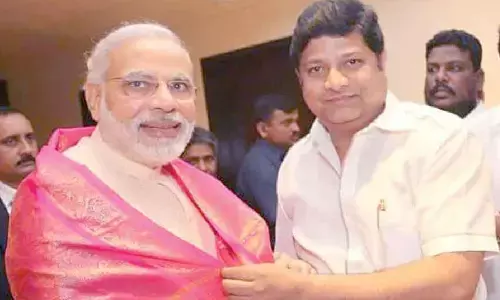 File photo of Perika Suresh felicitating PM Modi during his visit to Hyderabad