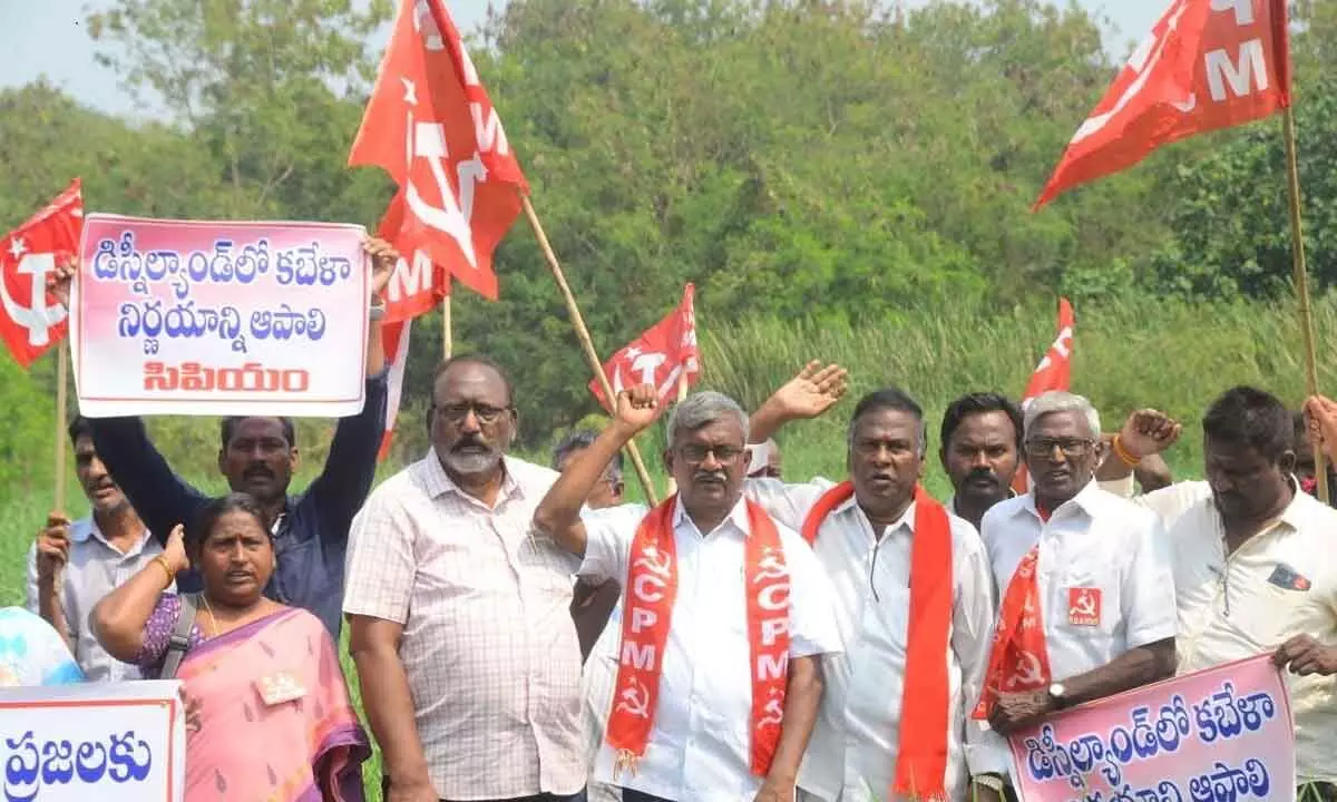 The leaders of the two communist paties staging a protest demonstration in Vijayawada demanding the land to be distributed to poor on Thursday