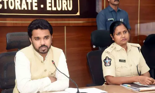 Collector Prasanna Venkatesh along with SP Mary Prasanthi holding a meeting in Eluru on Thursday