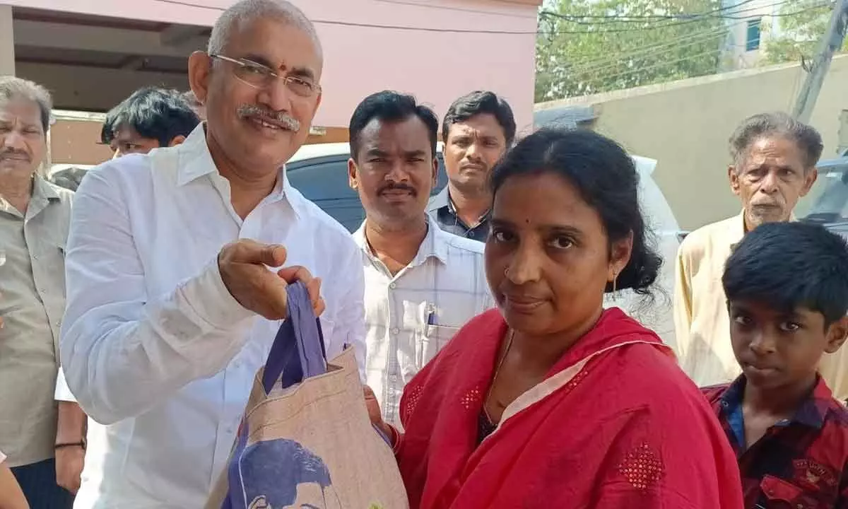 Minister Srinivasa Venugopala Krishna distributing ration at Kannamamba street in Rajamahendravaram on Sunday