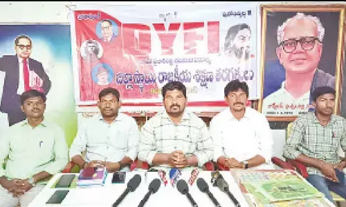 DYFI State secretary G Ramanna speaking at a press meet in Kadapa on Sunday