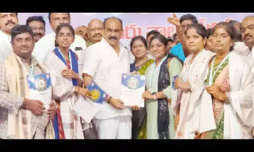 Ongole MLA Balineni Srinivasa Reddy presenting volunteers with Seva Vajra, Seva Ratna and Seva Mitra awards at Ongole on Sunday