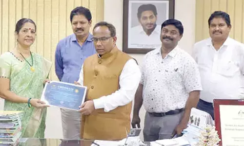 Vice-Chancellor of Acharya Nagarjuna University Prof P Rajasekhar appreciating Prof Saraswati Raju Iyer over her reappointment to the Advisory Group under Monterey Bay Aquarium Seafood Watch Programme, in Guntur on Monday