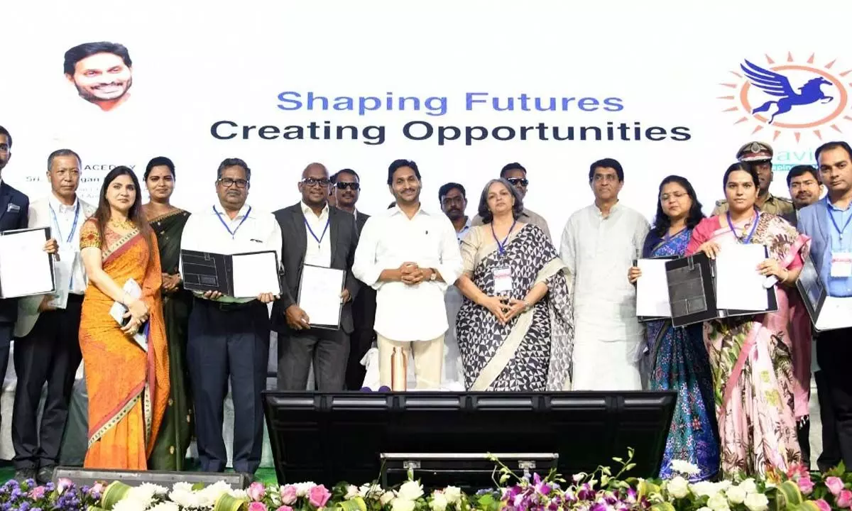 Chief Minister YS Jagan Mohan Reddy along with delegates who inked pacts with the AP government in Visakhapatnam on Tuesday.