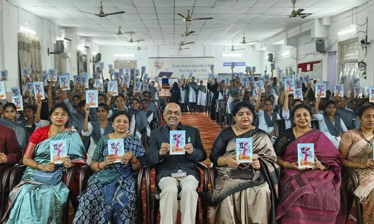 Participants releasing a book on Women Empowerment in Mahabharata at KBN College in Vijayawada on Tuesday