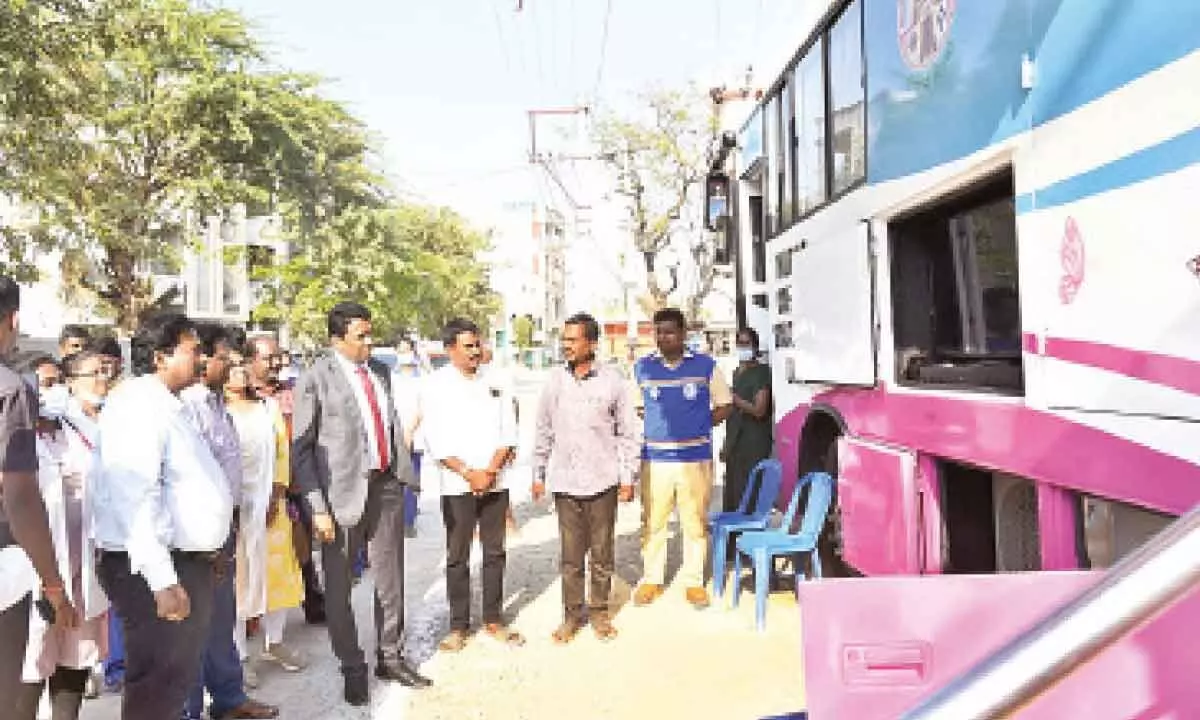 District Collector Dr G Lakshmisha inspecting pink bus screening camp at Settipalli in Tirupati on Thursday. DM&HO Dr U Sreehari and others are also seen.