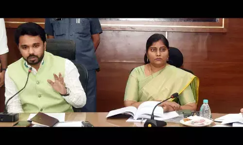 Collector Prasanna Venkatesh speaking at a meeting with officials and representatives of political parties in Eluru on Thursday. Joint Collector Lavanyaveni is also seen