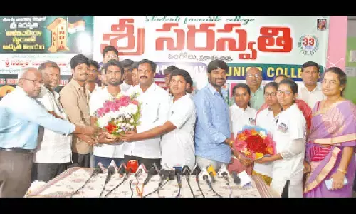 Sri Saraswathi Educational Institutions chairman AV Ramanareddy appreciating JEE Mains rankers in Ongole on Thursday