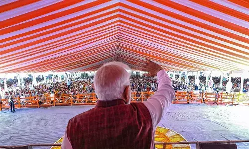 Prime Minister Narendra Modi speaks during the foundation stone laying and inauguration ceremony of various developmental projects, in Azamgarh on Sunday