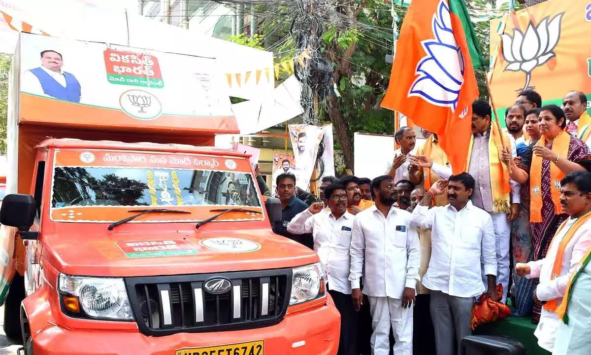 BJP State president D Purandeswari flagging off campaign vehicles of the party at the State BJP office in Vijayawada on Sunday 				          Photo: Ch Venkata Mastan