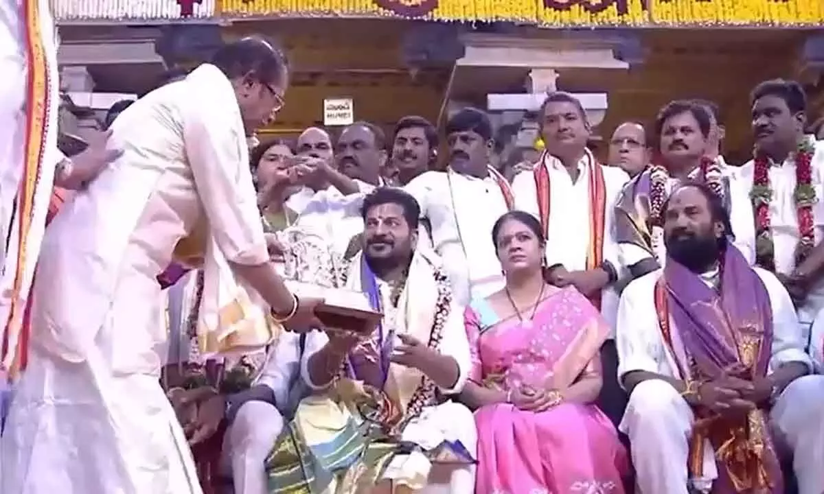 CM Revanth Reddy and wife presents Silk Saree and Pearl Necklace to deity in Bhadrachalam