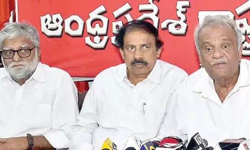 CPI national secretary K Narayana, state secretary  K Ramakrishna addressing a press conference at NR Dasari Bhavan in Vijayawada on Tuesday      Photo: Ch Venkata Mastan
