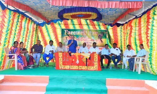 Chinnakeshampalle Zilla Parishad High School Telugu teachers distribute educational materials to class X students