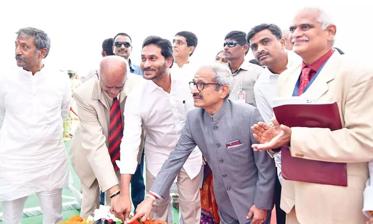 Chief Minister Y S Jagan Mohan Reddy accompanied by the retired judges laying the foundation stone for the construction of National Law University at Jagannatha Gattu in Kurnool on Thursday.