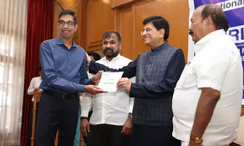 Piyush Goyal hands over salary dues to NTC employees