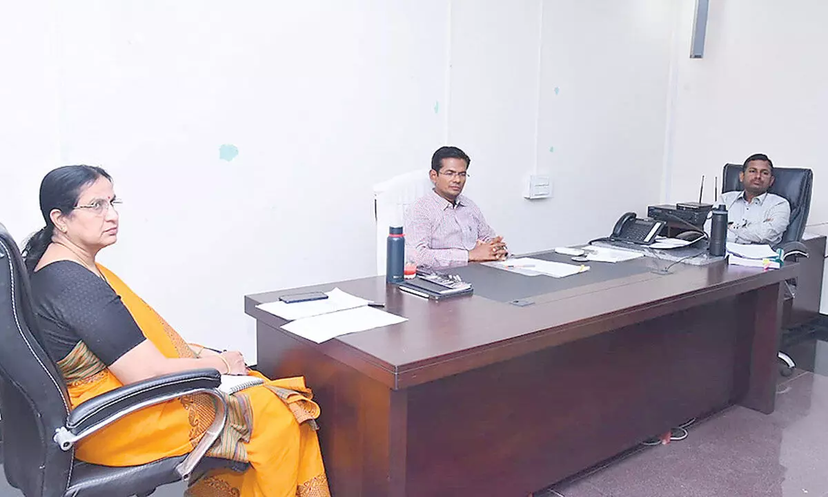 Prakasam District Collector A S Dinesh Kumar along with the JC and DRO creating awareness on the Model Code of Conduct to representatives of political parties and printers at the Collectorate in Ongole on Monday