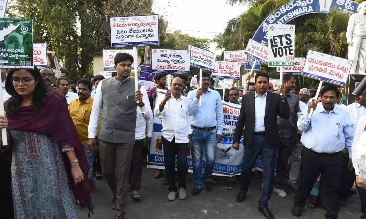 District Collector G Lakshmisha, Joint Collector HM Dhyana Chandra and other officials taking out a voting awareness rally in Tirupati on Monday