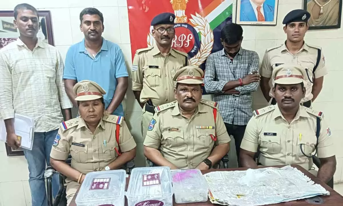 Railway  police officials disclosing the details of seized Silver ornaments from a suspicious person in Miryalguda railway station