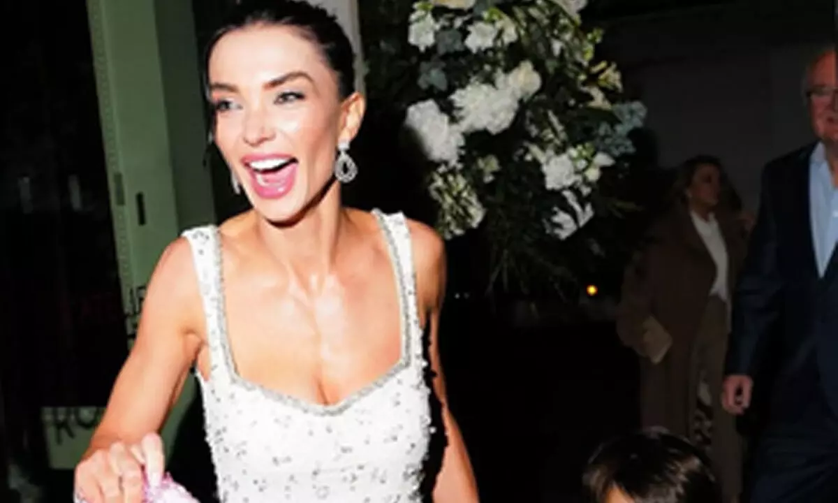 Amy Jackson holds sons hand, heart-shaped bag at engagement dinner with Ed Westwick