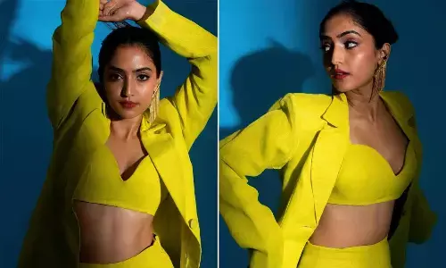 Reba John rocks in Neon powersuit look