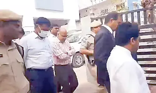 Two more cops held in phone tapping case