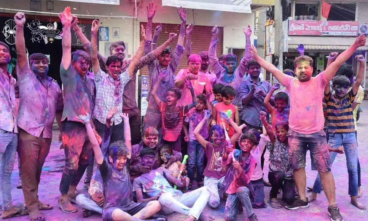 Youth and children celebrating Holi  in Ongole on Monday
