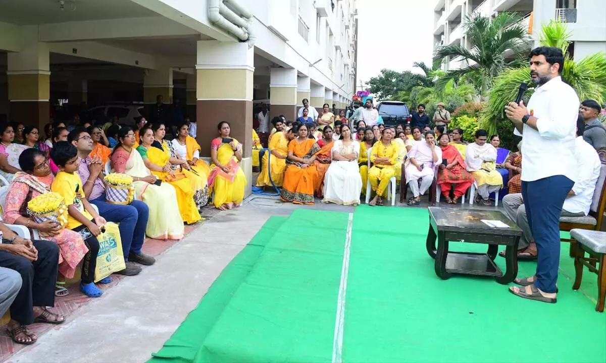 TDP Mangalagiri Assembly constituency candidate Nara Lokesh interacts with residents of an apartment complex in Tadepalli on Monday