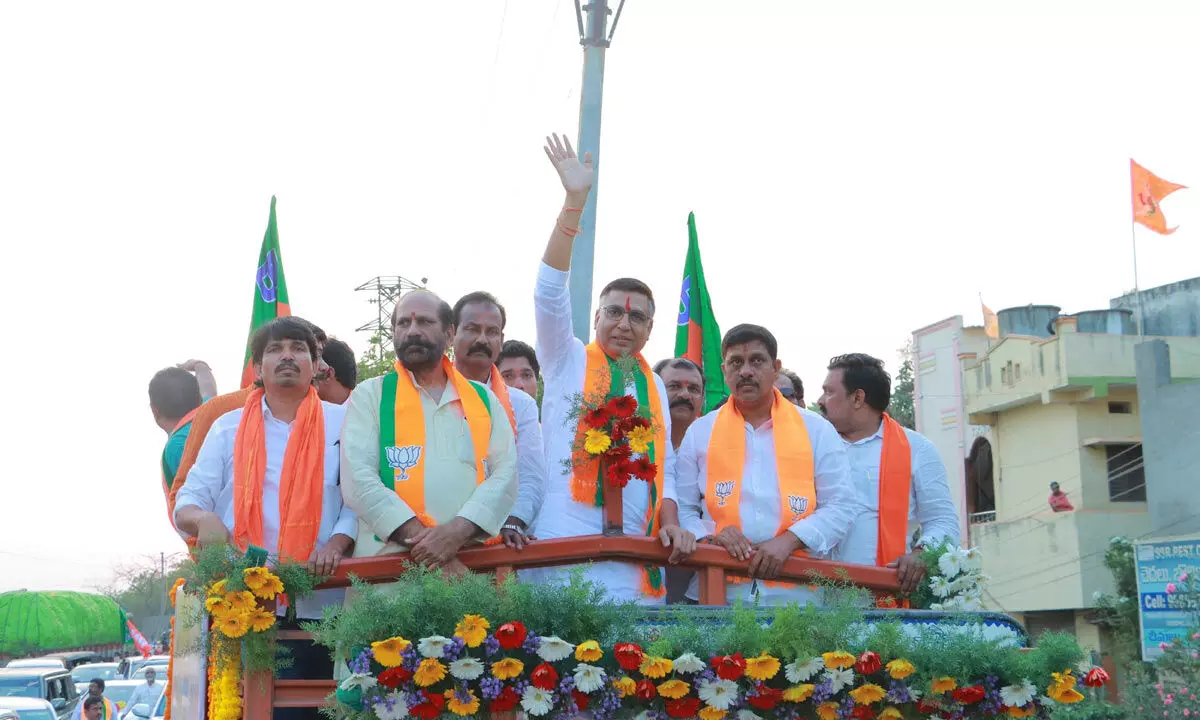 BJP MP candidate for Khammam Tandra Vinod Rao participating in a road show and bike rally on Tuesday