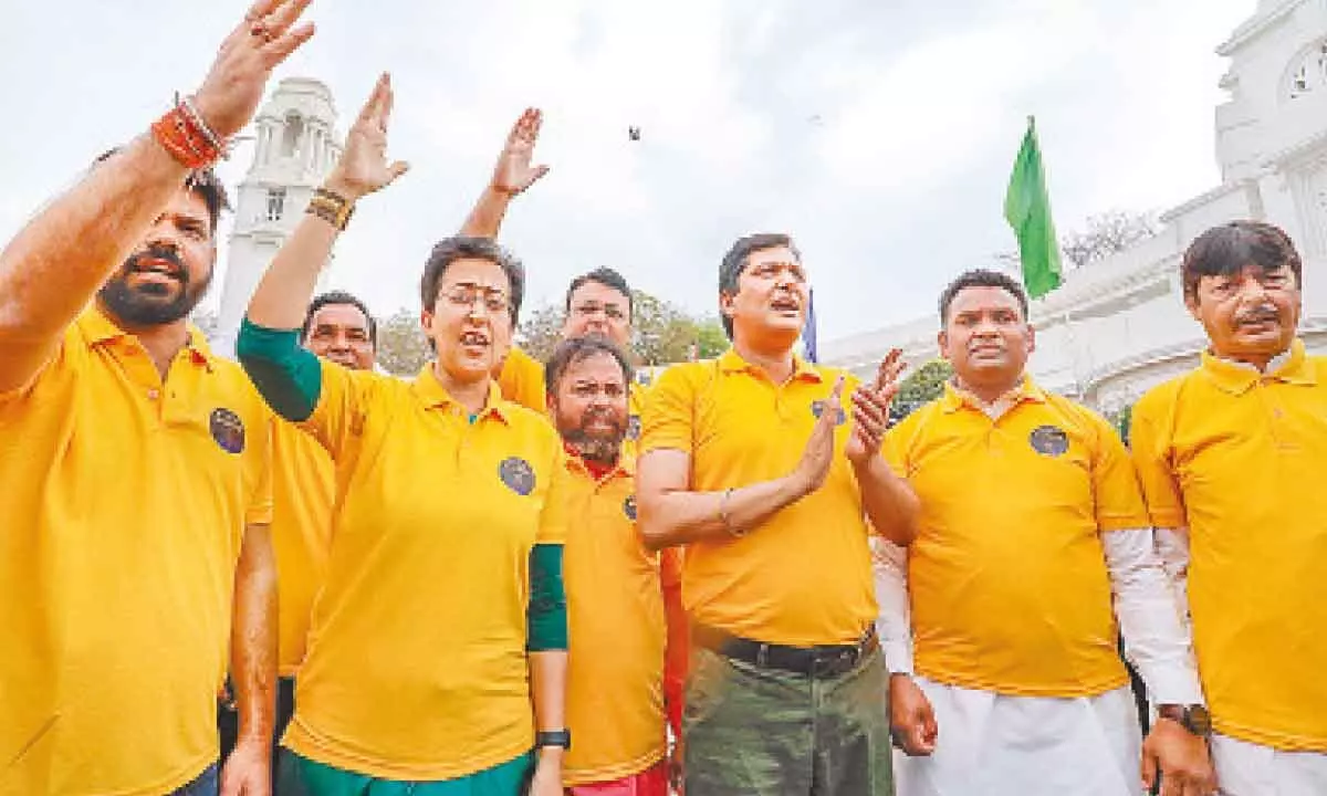 AAP MLAs wear yellow T-shirts, ‘Kejriwal’ masks at Assembly
