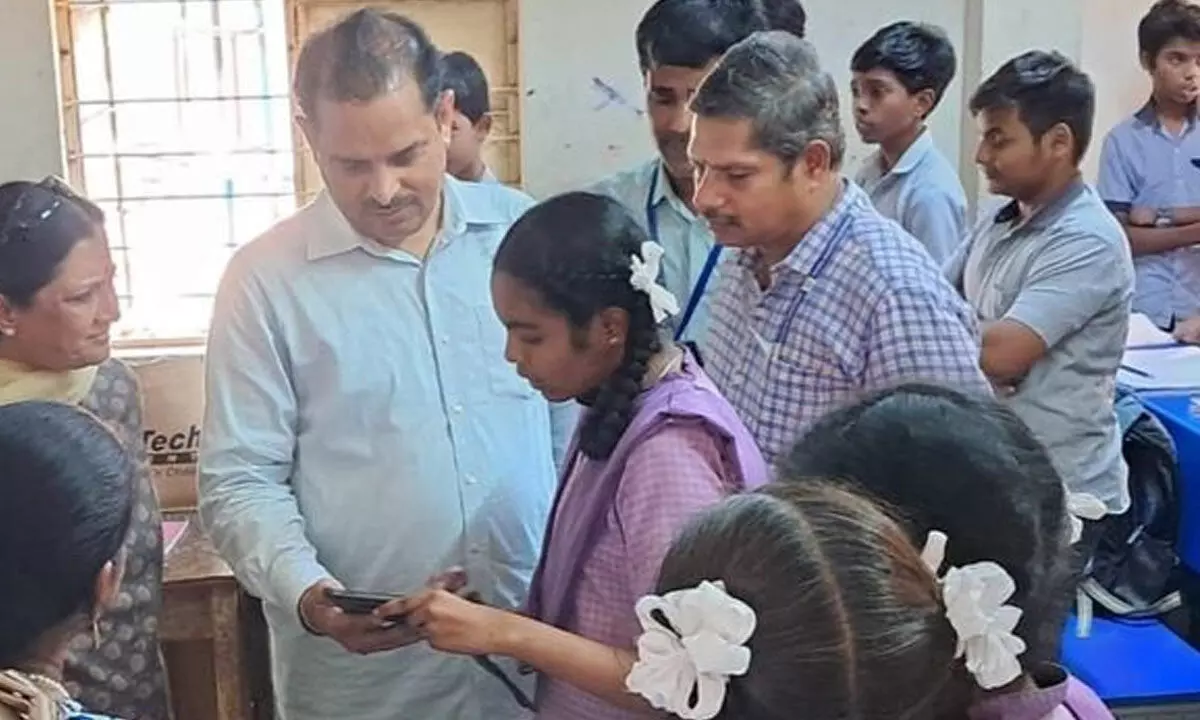 Pondicherry State Chief Secretary Sarath Chauhan interacting with students in Rajamahendravaram on Thursday