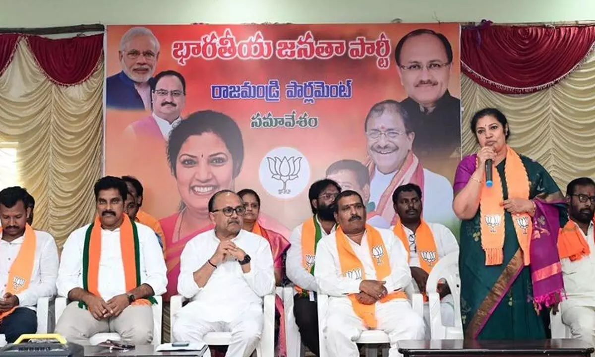 BJP state president Daggubati Purandeswari addressing party workers at BJP office in Rajamahendravaram on Thursday. AP election co-in-charge Siddharth Nath Singh and other others are also seen.